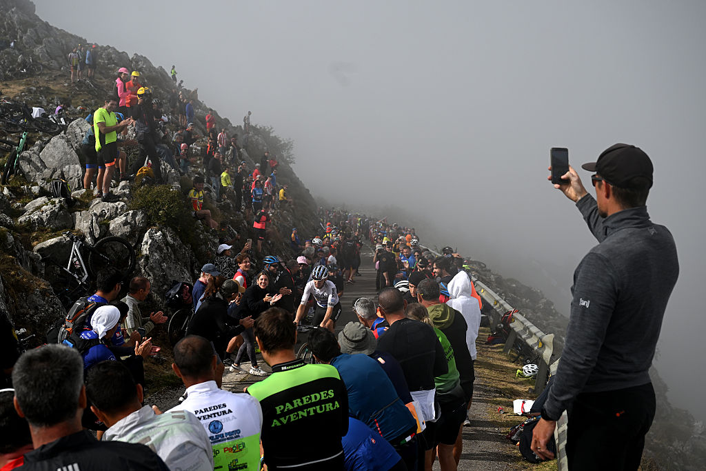 L'ANGLIRU, SPAIN - SEPTEMBER 05: Guillermo Thomas Silva of Uruguay and Team Caja Rural - Seguros RGA competes in the chase group climbing the L'Angliru while fans cheer during the La Vuelta - 80th Tour of Spain 2025, Stage 13 a 203.7km stage from Cabezon de la Sal to L'Angliru 1556m / #UCIWT / on September 05, 2025 in L'Angliru, Spain. (Photo by Dario Belingheri/Getty Images)